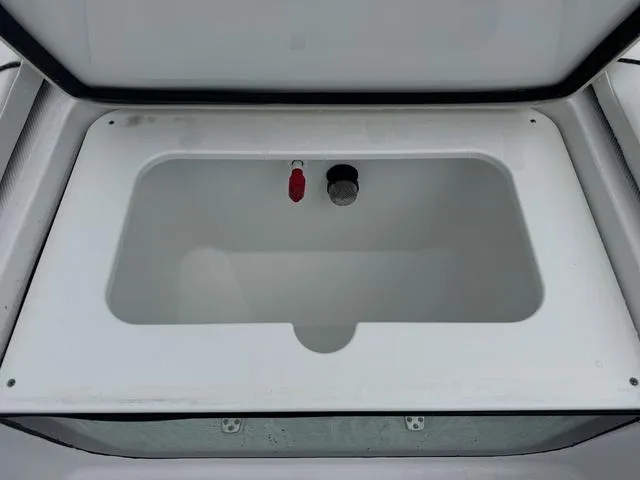 Slide: The Image of Livewell compartment of 2025 Wellcraft 202 Fisherman boat, open and empty. - 15