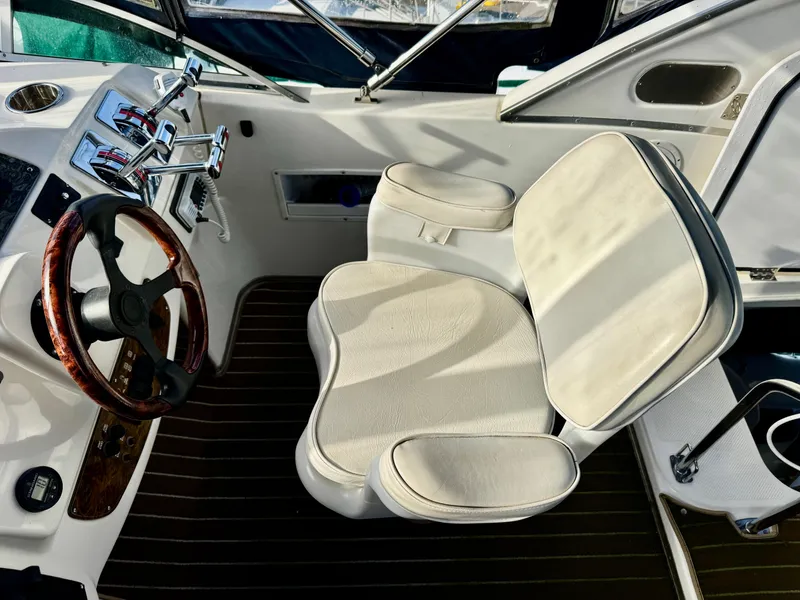 Slide: The Image of Interior helm of 2002 Bayliner 3488 Command Bridge with steering wheel and captain's chair. - 10