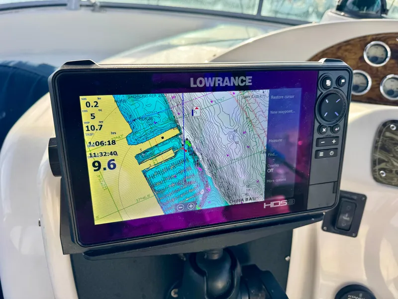 Slide: The Image of Lowrance GPS display on 2002 Bayliner 3488 Command Bridge boat dashboard. - 12