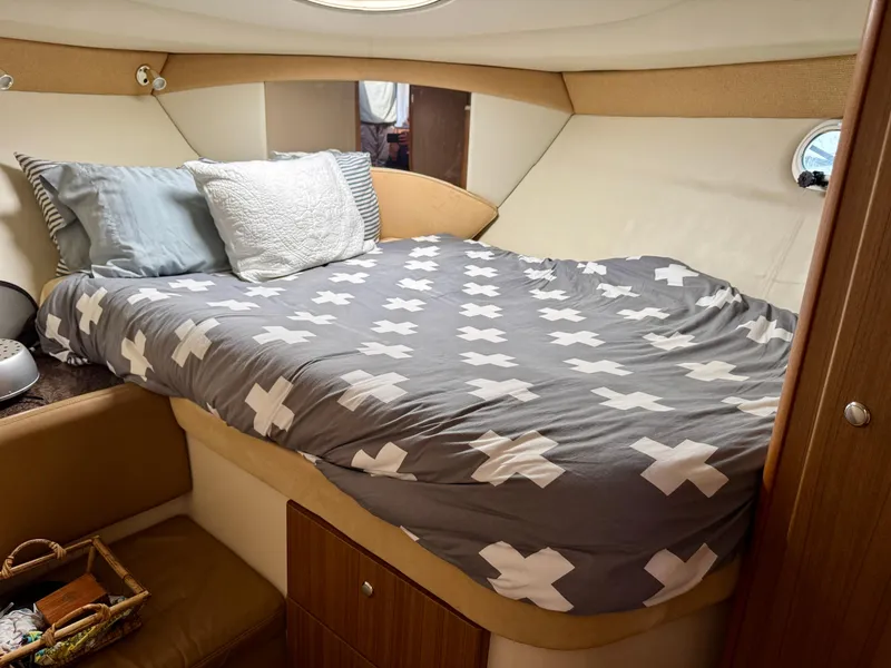 Slide: The Image of Cozy bedroom in 2002 Bayliner 3488 Command Bridge yacht with patterned bedding. - 17