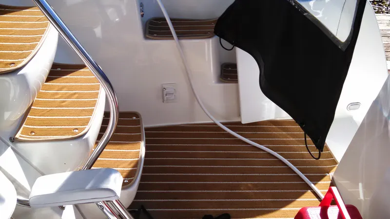 Slide: The Image of 2002 Bayliner 3488 Command Bridge interior with wooden steps and seating area. - 31