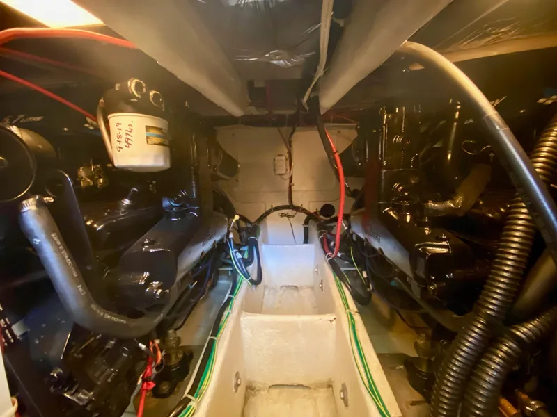 Slide: The Image of Engine room of 2002 Bayliner 3488 Command Bridge with visible components and wiring. - 33