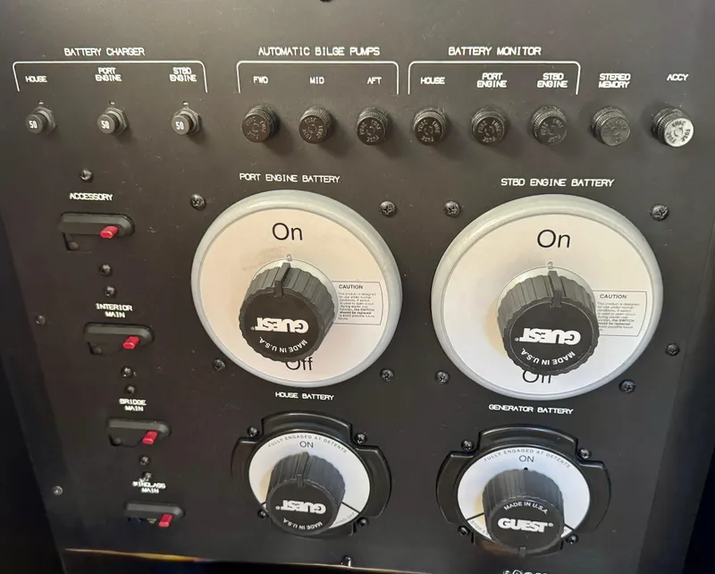 Slide: The Image of Control panel of a 2002 Bayliner 3488 Command Bridge with battery and pump switches. - 36