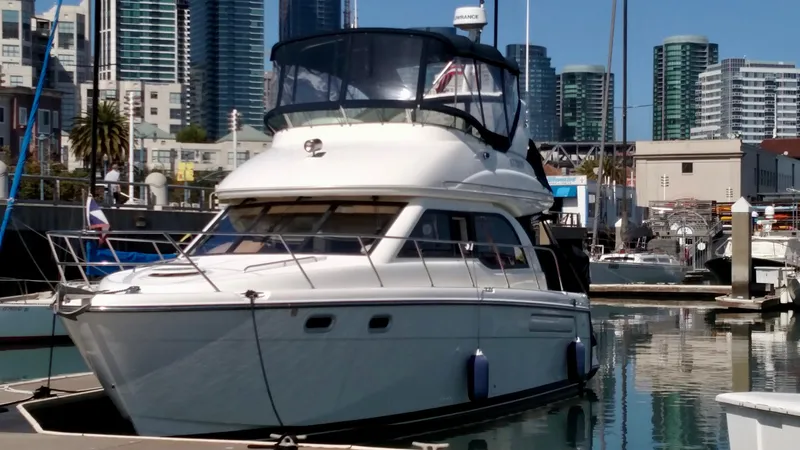 Slide: The Image of Bayliner 3488 Command Bridge 2002 yacht docked in urban marina. - 6