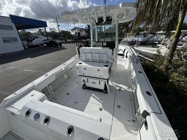 Slide: The Image of 2025 Blackfin 252CC boat interior, featuring spacious deck and modern console. - 11