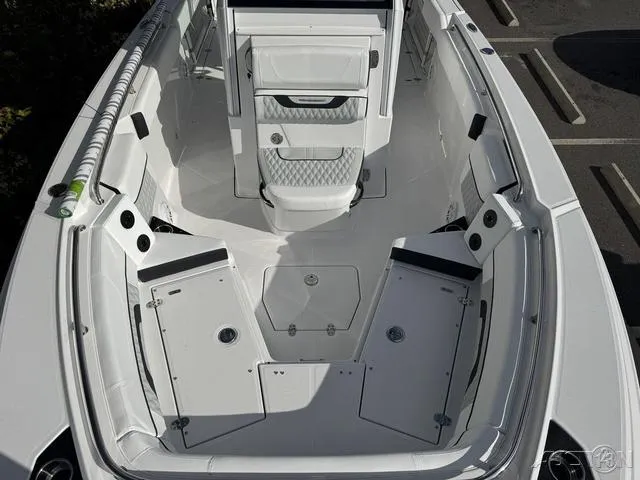 Slide: The Image of 2025 Blackfin 252CC boat interior with spacious seating and storage compartments. - 23