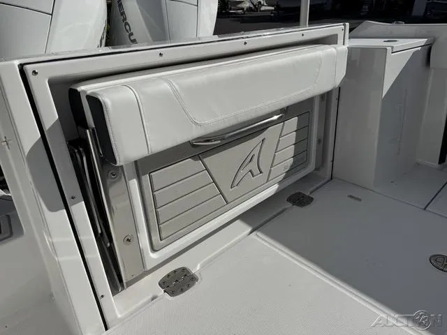 Slide: The Image of 2025 Blackfin 252CC boat interior with foldable seat and storage compartment. - 30