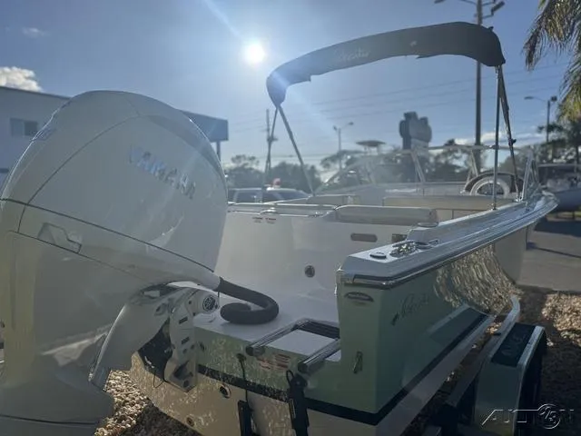 Slide: The Image of 2025 Rossiter 20 boat with Yamaha outboard motor in sunny outdoor setting. - 7