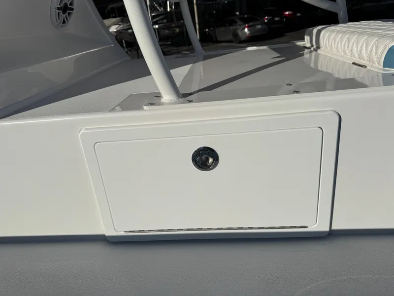 Slide: The Image of 2025 Shallow Sport 24 Sport boat deck with storage compartment. - 10