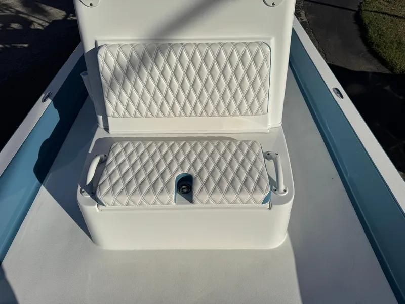 Slide: The Image of 2025 Shallow Sport 24 Sport boat with white quilted seating. - 19