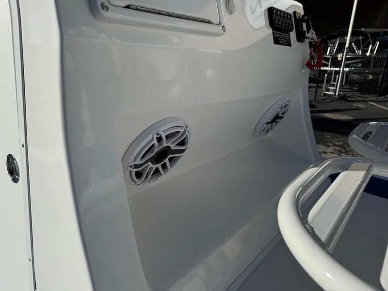 Slide: The Image of 2025 Shallow Sport 24 Sport boat interior with speakers and control panel. - 21