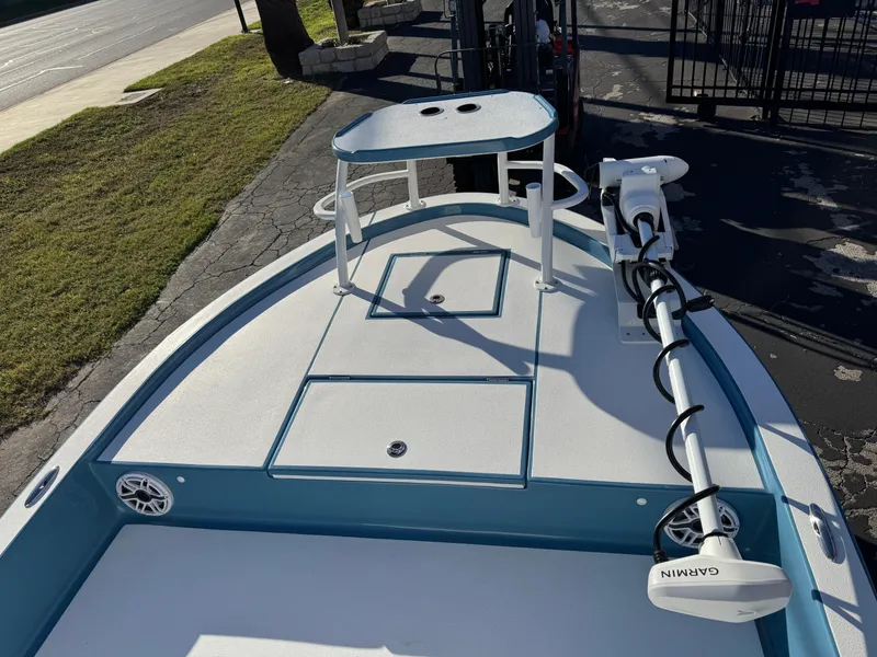 Slide: The Image of 2025 Shallow Sport 24 Sport boat with Garmin trolling motor on deck. - 25