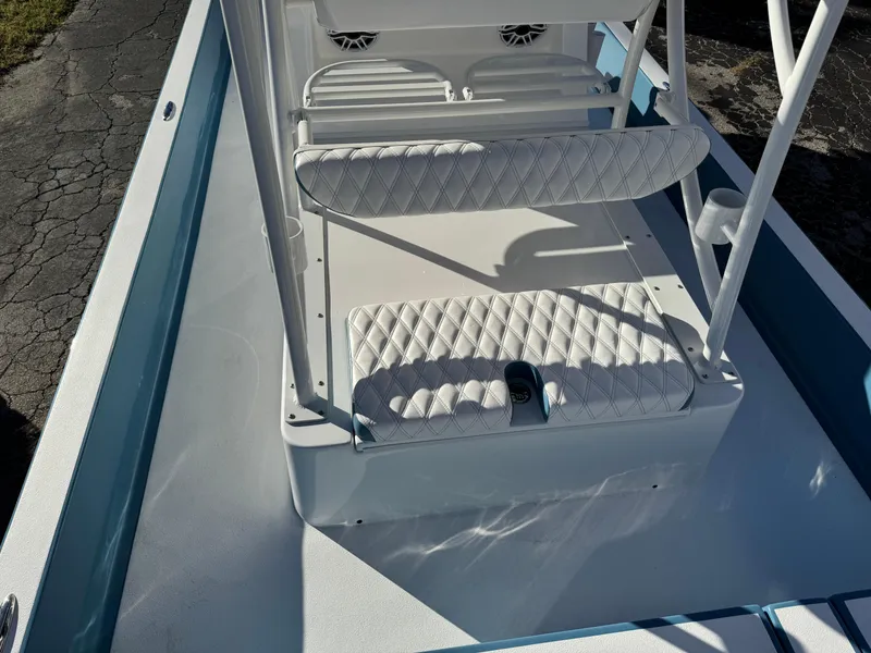 Slide: The Image of 2025 Shallow Sport 24 Sport boat interior with white cushioned seating. - 30