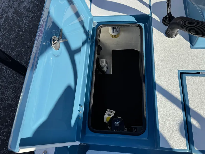 Slide: The Image of Open storage compartment in 2025 Shallow Sport 24 Sport boat. - 33