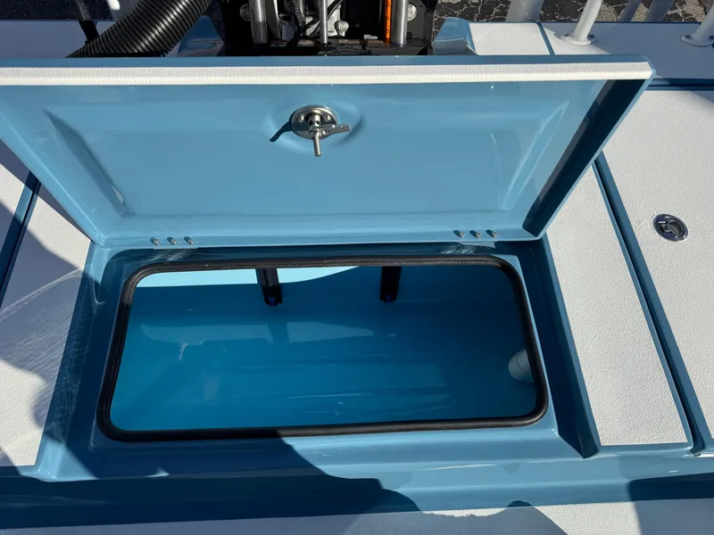 Slide: The Image of Open storage compartment on 2025 Shallow Sport 24 Sport boat. - 34
