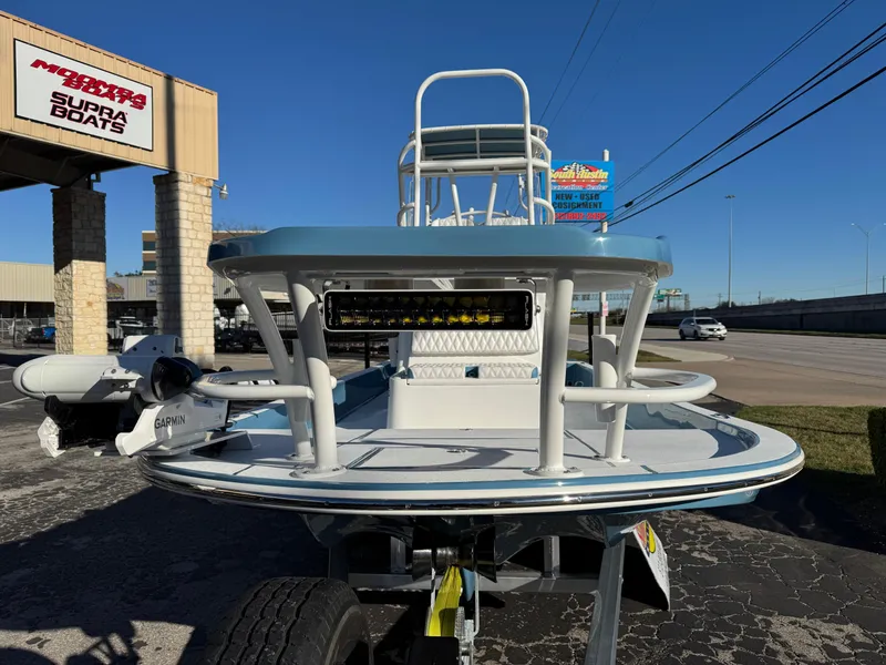 Slide: The Image of 2025 Shallow Sport 24 Sport boat on trailer at dealership. - 4