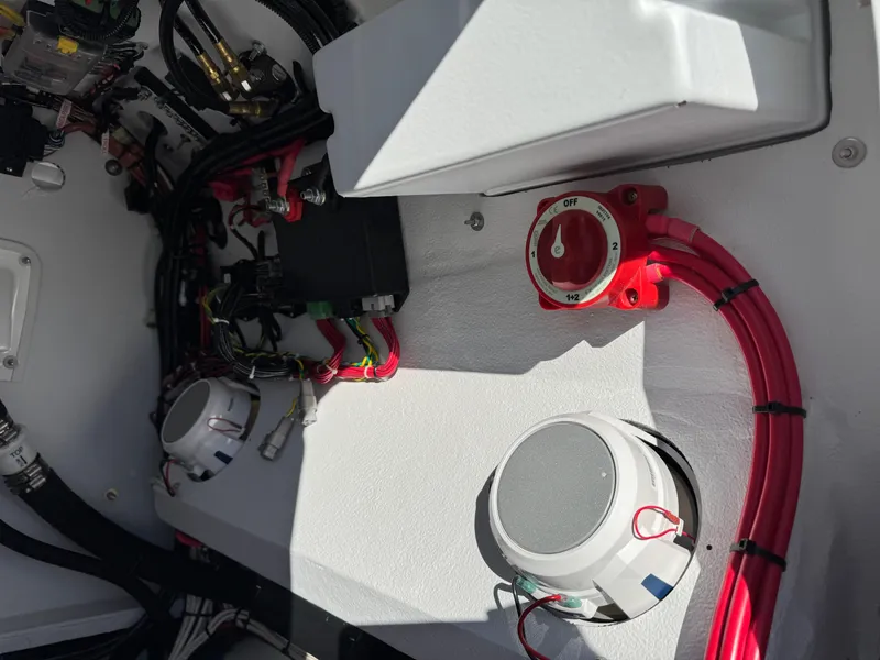 Slide: The Image of Interior view of 2025 Shallow Sport 24 Sport boat wiring and controls. - 8