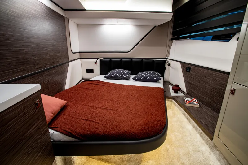 Slide: The Image of Luxurious cabin interior of 2026 Cobrey 45 Fly yacht with modern design and cozy bedding. - 6