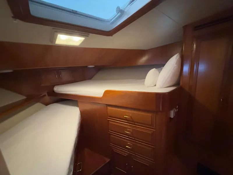 Slide: The Image of Luxurious cabin interior of 1988 Ocean Alexander 42 CPMY yacht with wooden finish. - 23