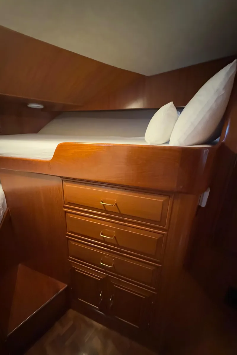 Slide: The Image of 1988 Ocean Alexander 42 CPMY cabin with wooden drawers and cozy bed. - 26