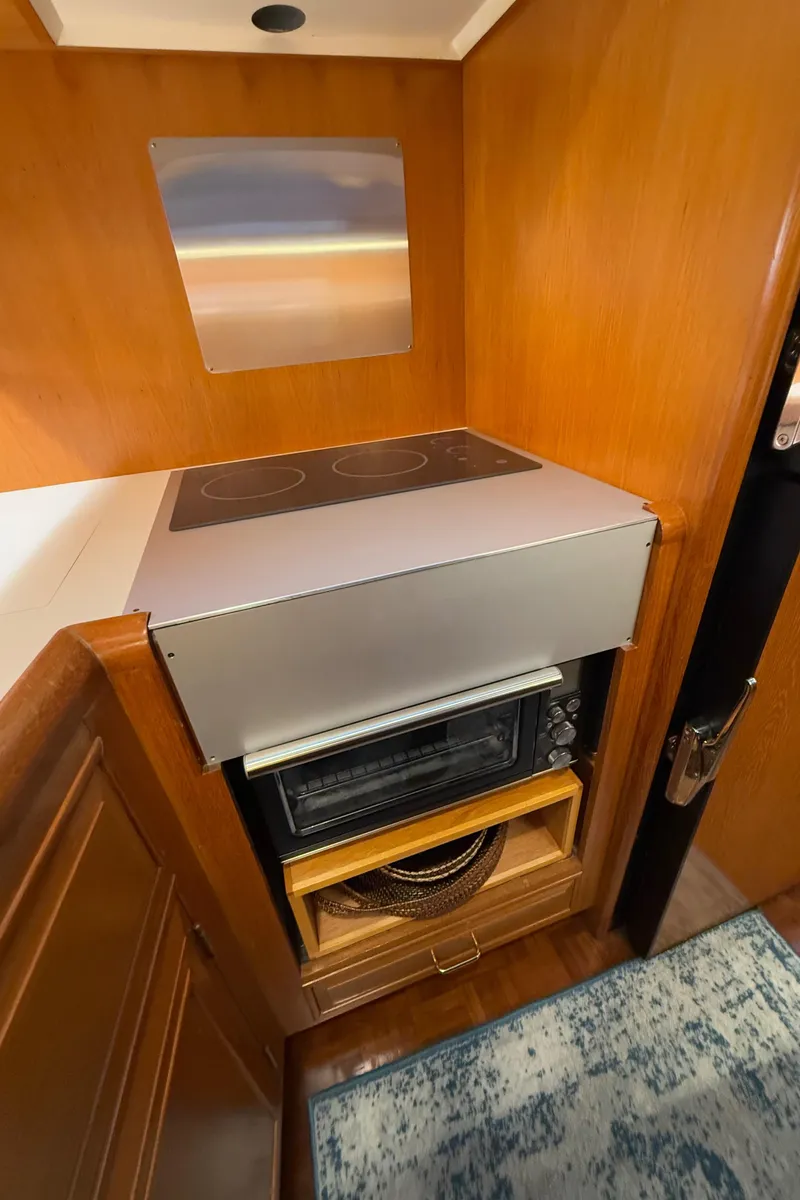 Slide: The Image of 1988 Ocean Alexander 42 CPMY yacht kitchen with stove and oven. - 30