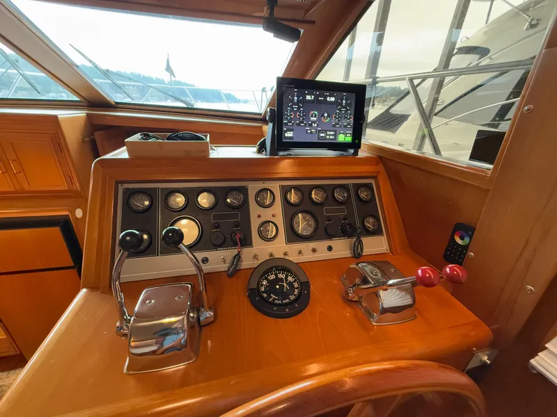 Slide: The Image of Control panel of 1988 Ocean Alexander 42 CPMY yacht with navigation instruments. - 33