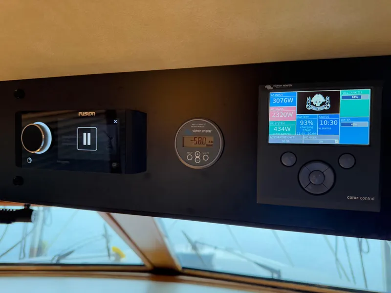 Slide: The Image of Control panel of a 1988 Ocean Alexander 42 CPMY yacht with modern navigation displays. - 36