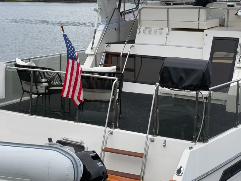 Slide: The Image of 1988 Ocean Alexander 42 CPMY yacht with American flag on deck. - 40