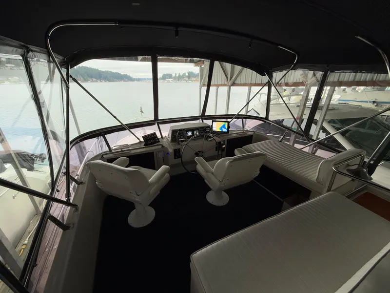 Slide: The Image of Interior view of 1988 Ocean Alexander 42 CPMY yacht helm with lake view. - 41