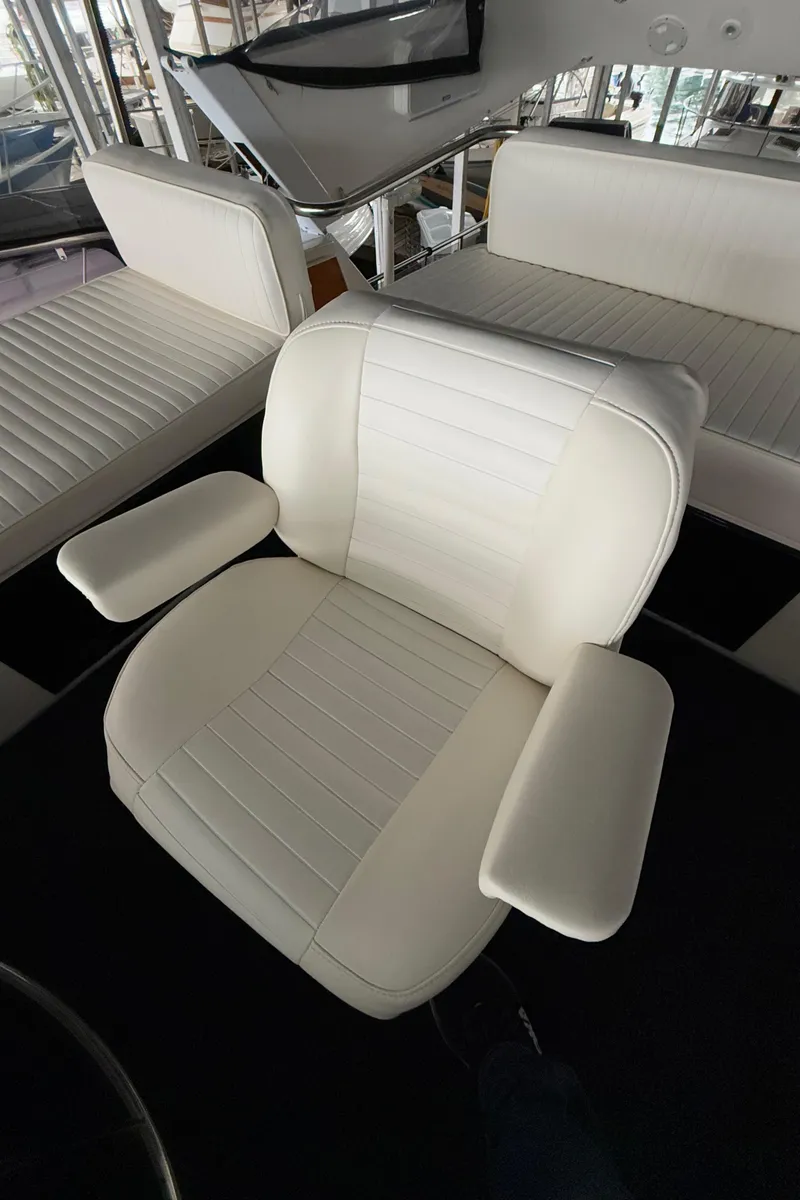 Slide: The Image of White captain's chair on 1988 Ocean Alexander 42 CPMY yacht. - 44