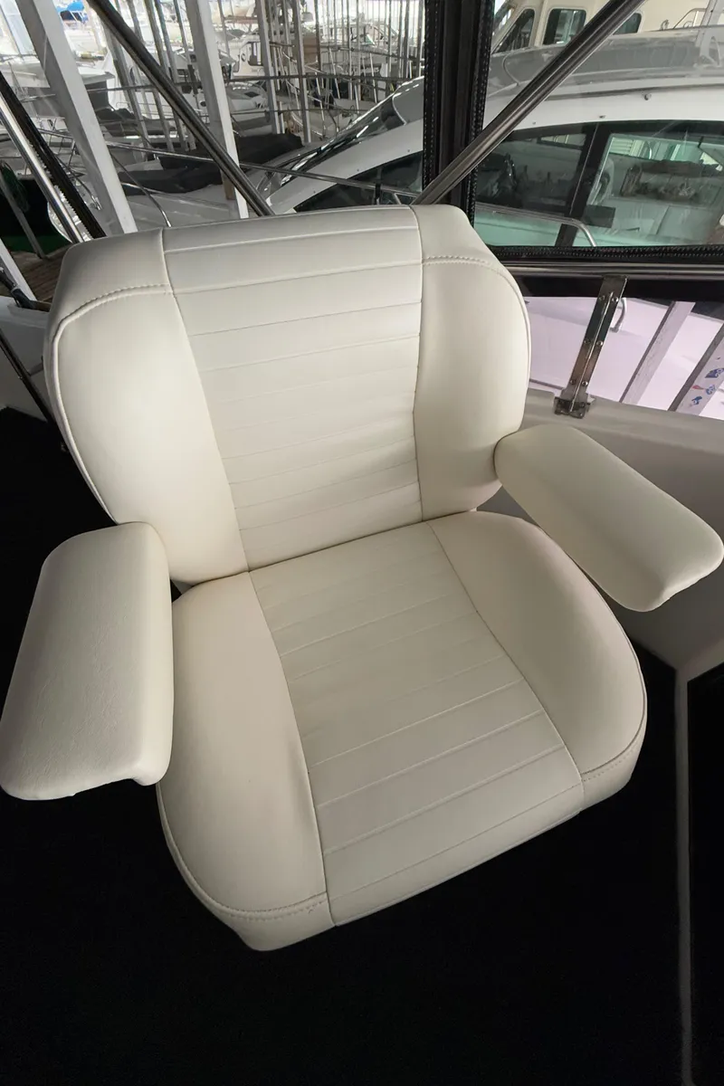 Slide: The Image of White captain's chair on 1988 Ocean Alexander 42 CPMY yacht. - 45