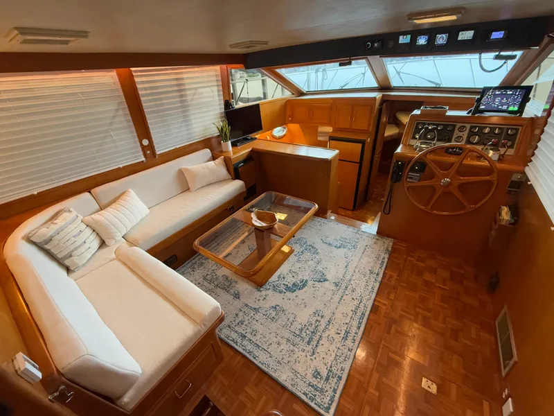 Slide: The Image of Luxurious 1988 Ocean Alexander 42 CPMY yacht interior with elegant seating and navigation area. - 5