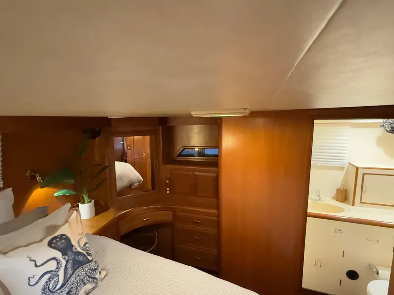 Slide: The Image of Luxurious 1988 Ocean Alexander 42 CPMY yacht cabin with elegant wood interior. - 8