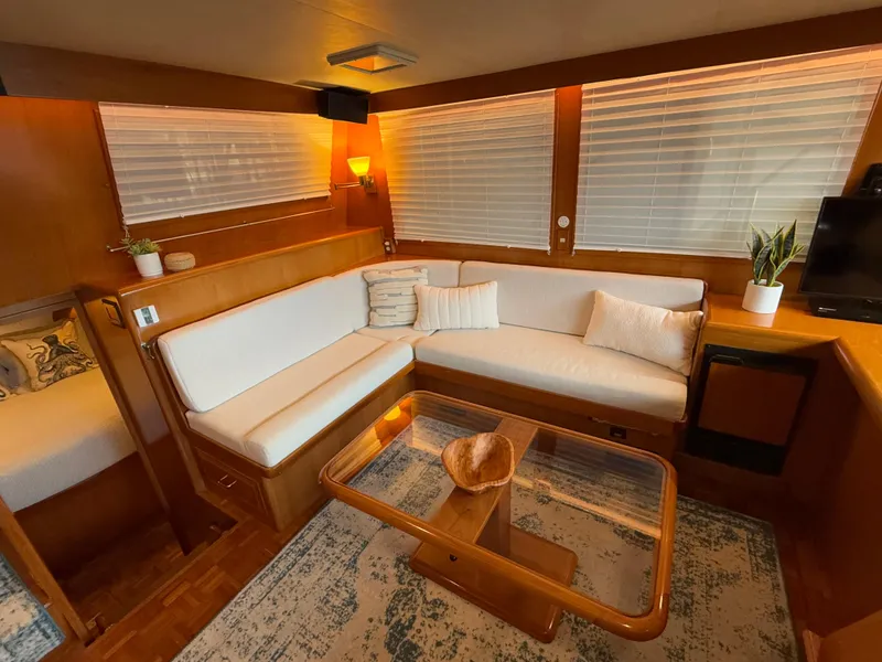 Slide: The Image of Luxurious 1988 Ocean Alexander 42 CPMY yacht interior with cozy seating and elegant decor. - 9