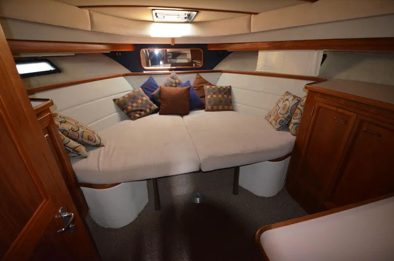 Slide: The Image of Interior of 1987 Carver 4207 yacht with cozy seating and decorative pillows. - 12