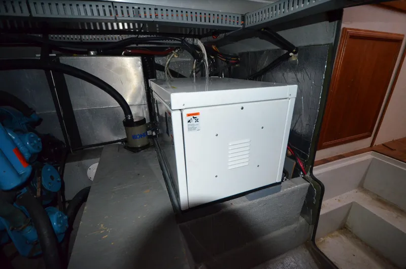 Slide: The Image of Engine room of 1987 Carver 4207 with equipment and wiring. - 19