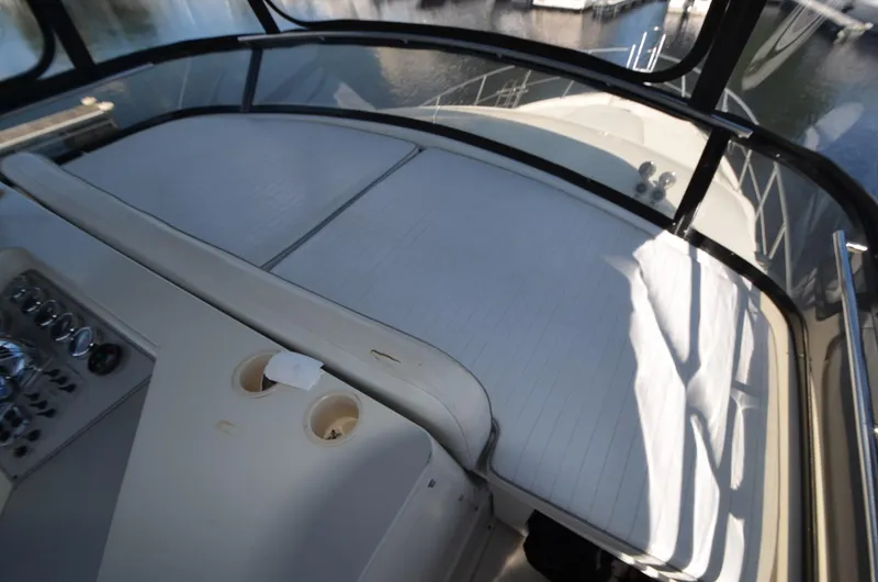 Slide: The Image of 1987 Carver 4207 yacht interior with helm controls and seating area. - 32