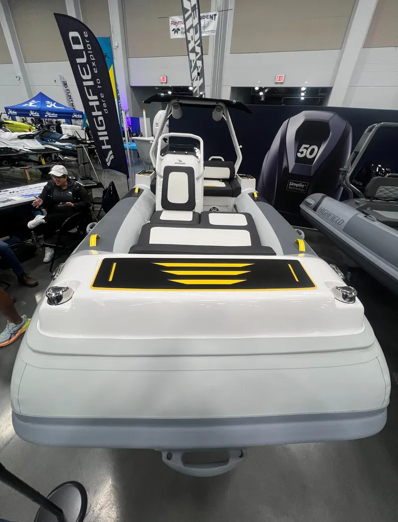 Slide: The Image of 2025 Highfield Velox 420 inflatable boat on display at a marine exhibition. - 1
