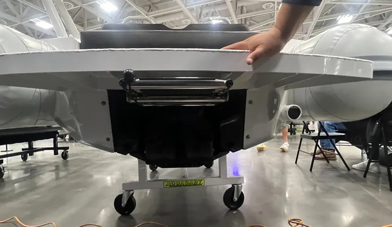 Slide: The Image of 2025 Highfield Velox 420 boat underside view in a showroom setting. - 5