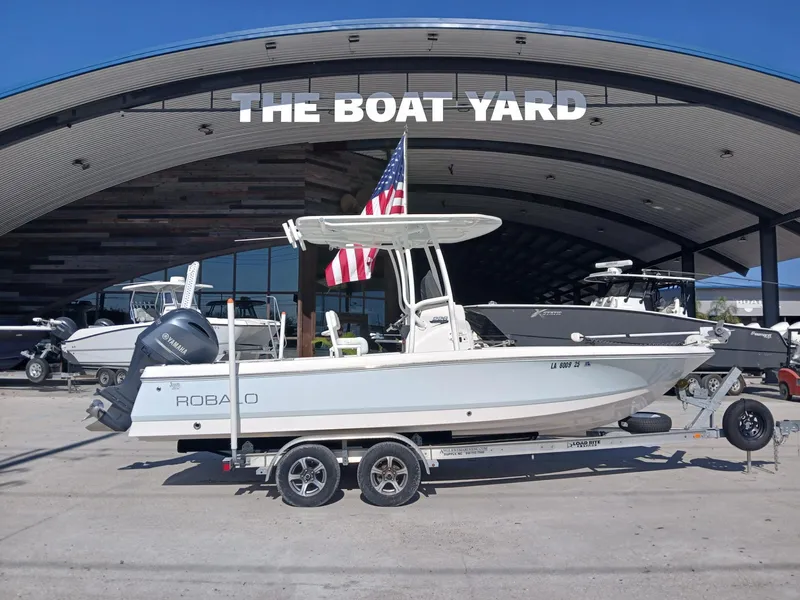 Slide: The Image of 2018 Robalo 226 Cayman boat on trailer at The Boat Yard. - 2