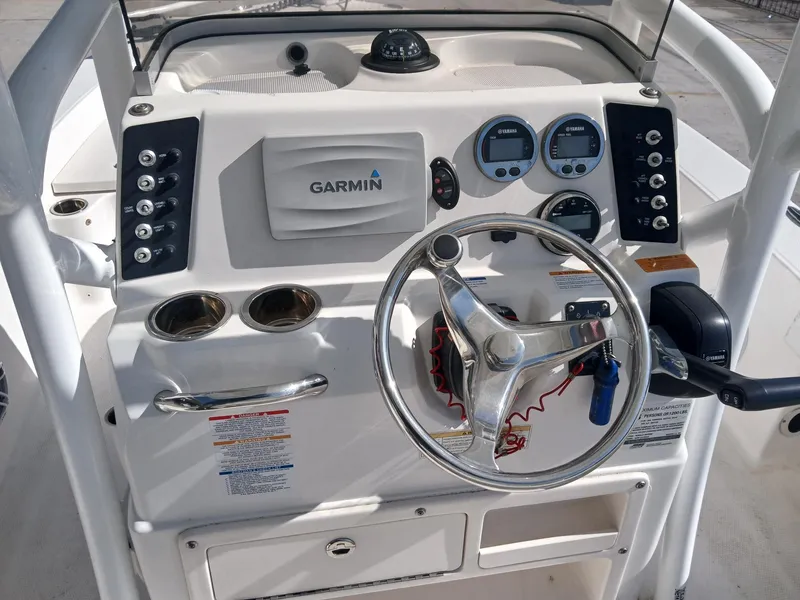 Slide: The Image of 2018 Robalo 226 Cayman boat dashboard with Garmin navigation and Yamaha controls. - 6