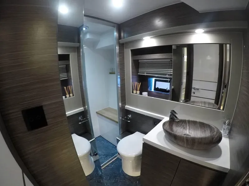Slide: The Image of Luxurious bathroom in 2026 Cobrey 52 Hardtop yacht with modern fixtures and elegant design. - 7