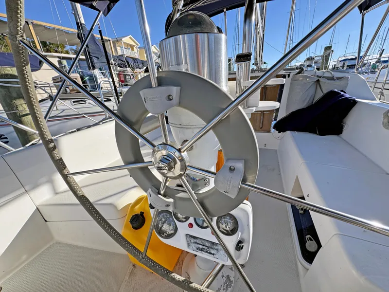 Slide: The Image of Steering wheel of a 2000 Catalina 36 MkII sailboat in a marina. - 19