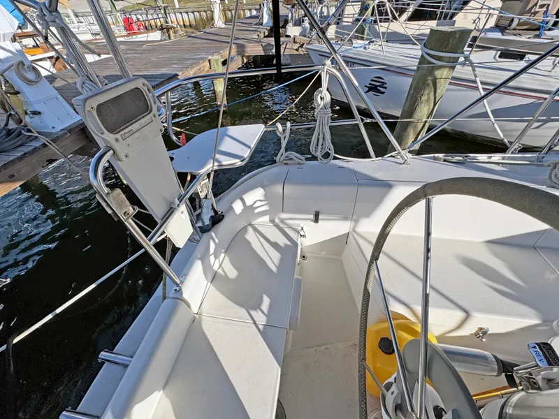 Slide: The Image of Cockpit of 2000 Catalina 36 MkII sailboat with steering wheel and seating area. - 22