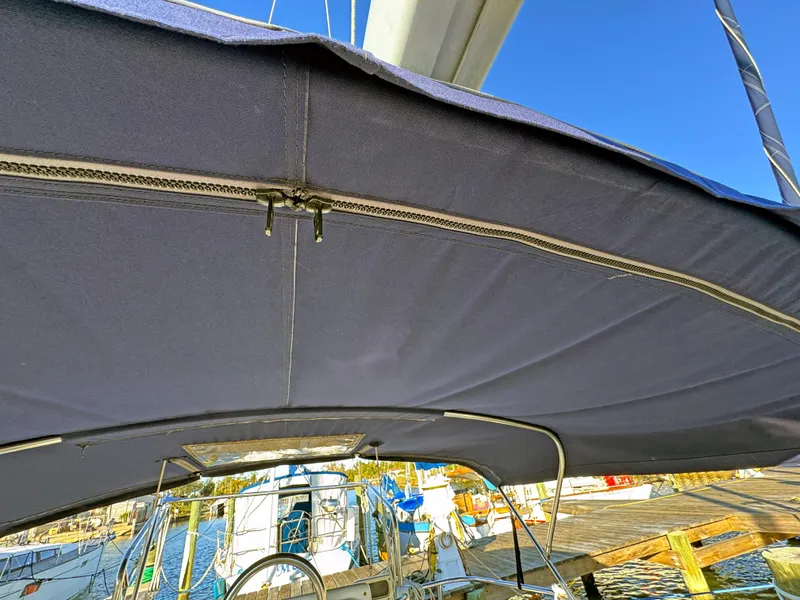 Slide: The Image of Catalina 36 MkII 2000 sailboat cockpit with blue bimini cover at marina. - 29