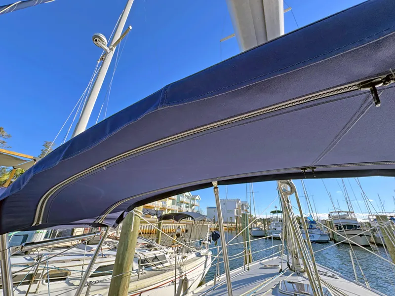 Slide: The Image of Catalina 36 MkII sailboat, 2000 model, docked with blue canopy and clear sky. - 30