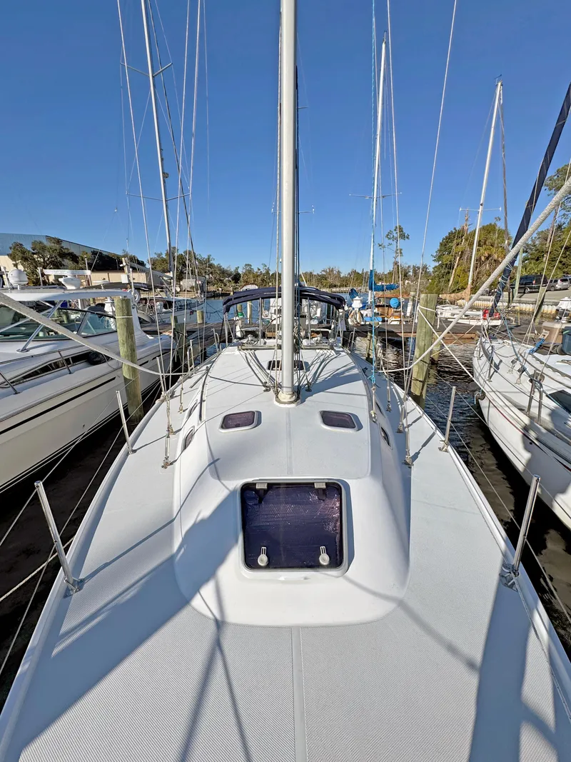 Slide: The Image of Catalina 36 MkII sailboat, 2000 model, docked in a marina under clear blue skies. - 36
