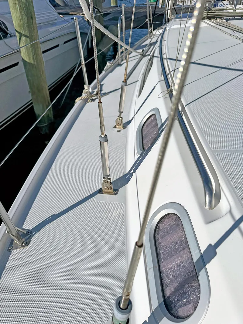 Slide: The Image of Catalina 36 MkII 2000 sailboat deck with rigging and portholes in marina. - 40