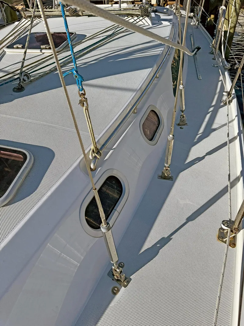 Slide: The Image of 2000 Catalina 36 MkII sailboat deck with rigging and portholes. - 41