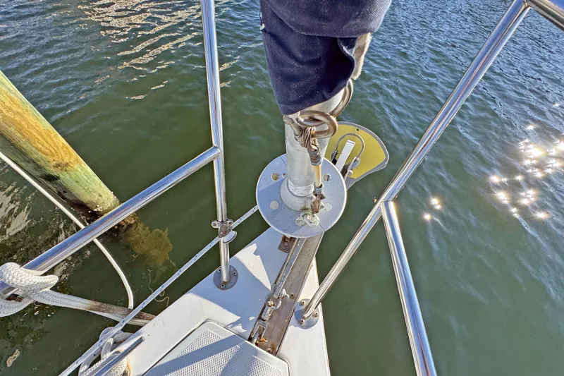 Slide: The Image of Bow of 2000 Catalina 36 MkII sailboat with stainless steel fittings and calm water. - 43